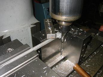  Without any support, the cutter was pulling the rod up and would break it if we continued.  We bolt a stop to the inside corner plate which prevented this from happening.  Finally we were able to finish this machining operation.